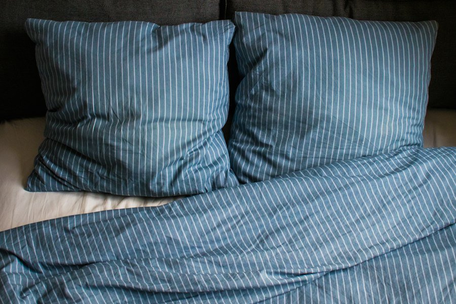 Bed made with sheets, pillows and blanket