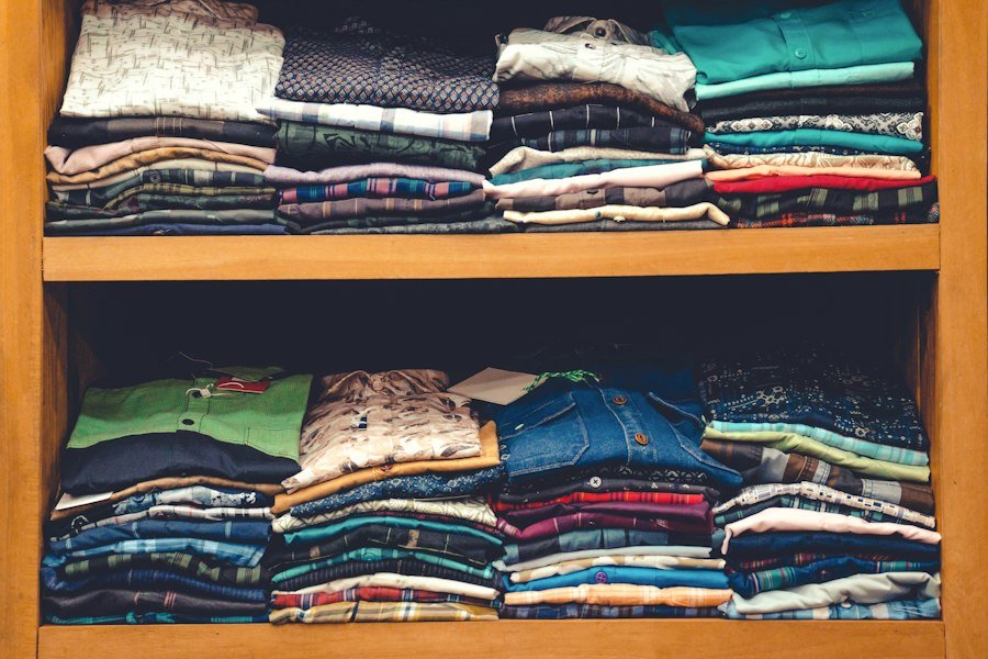 Shelf of folded shirt and trouser fabrics