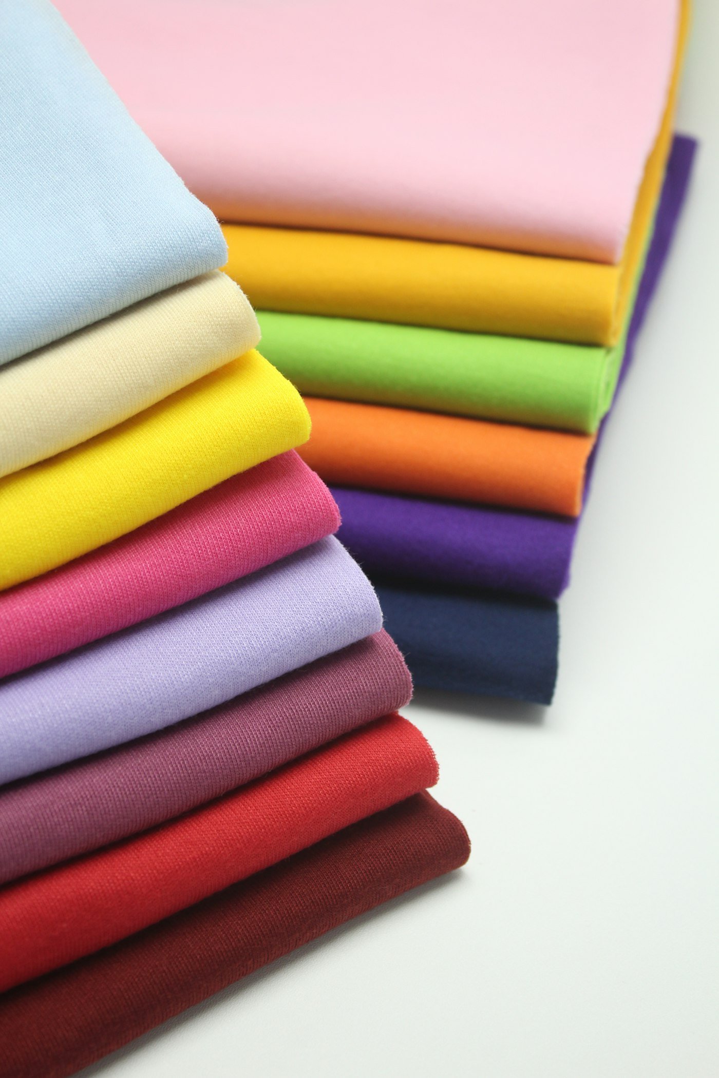 Pile of multi-coloured textiles