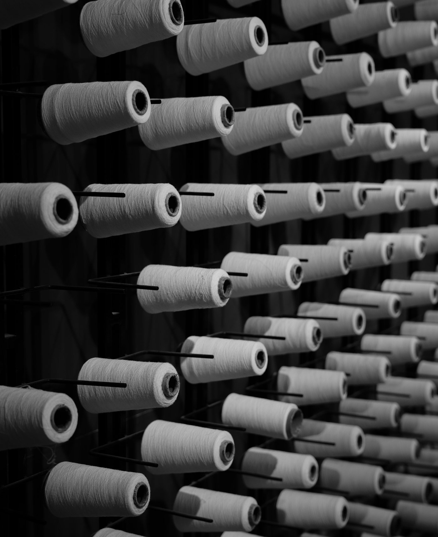 Rows of white thread spools