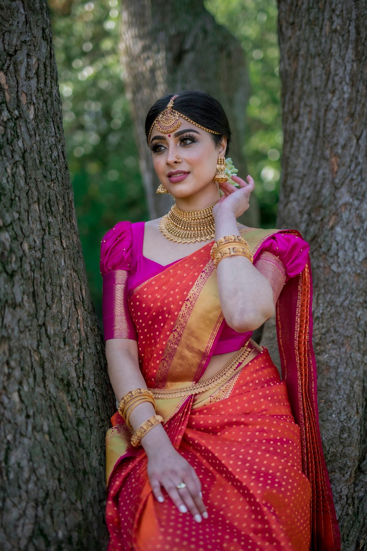 Woman in a pink and orange saree